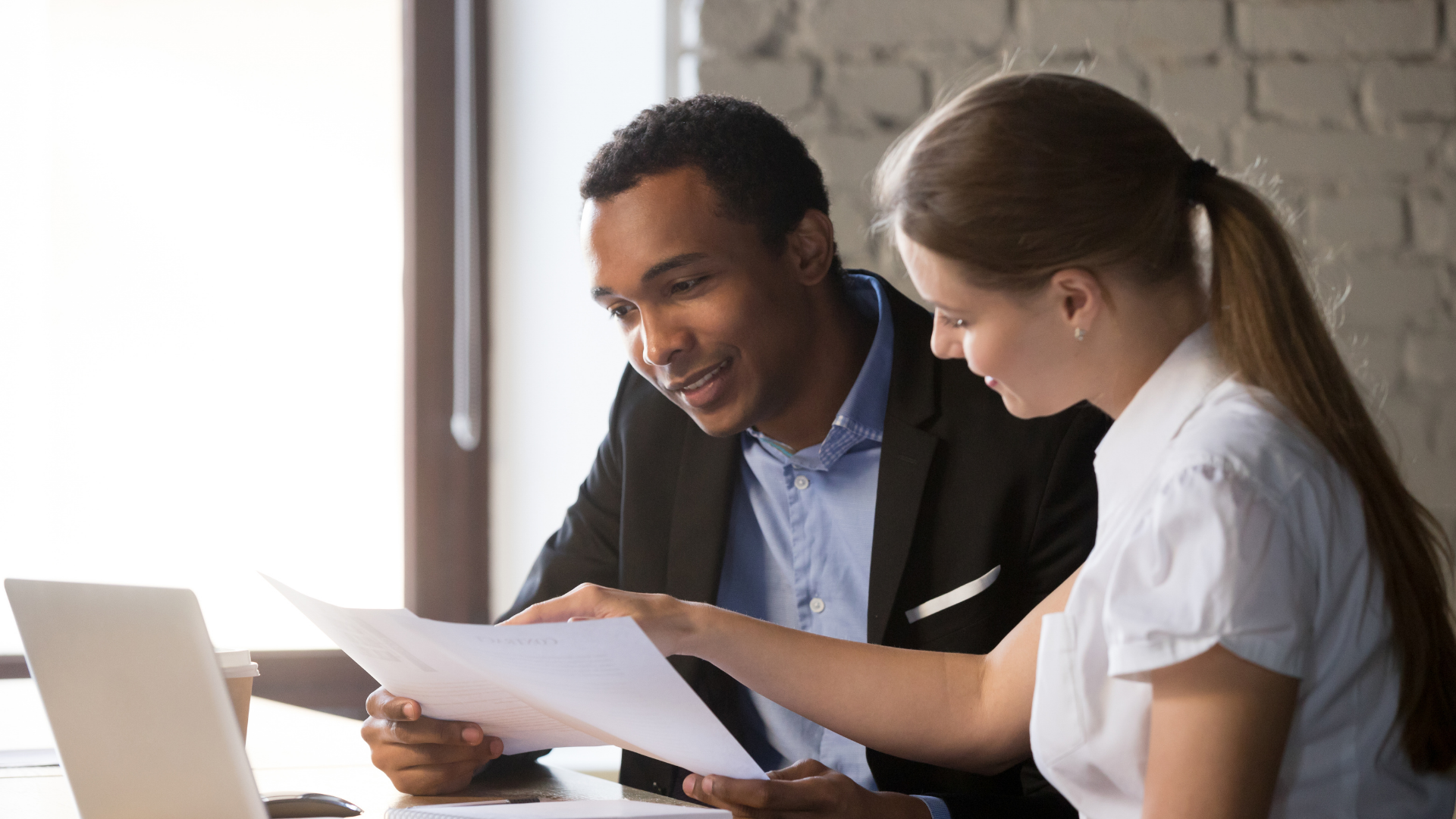 A business owner consulting with a Profit First-certified business advisor.